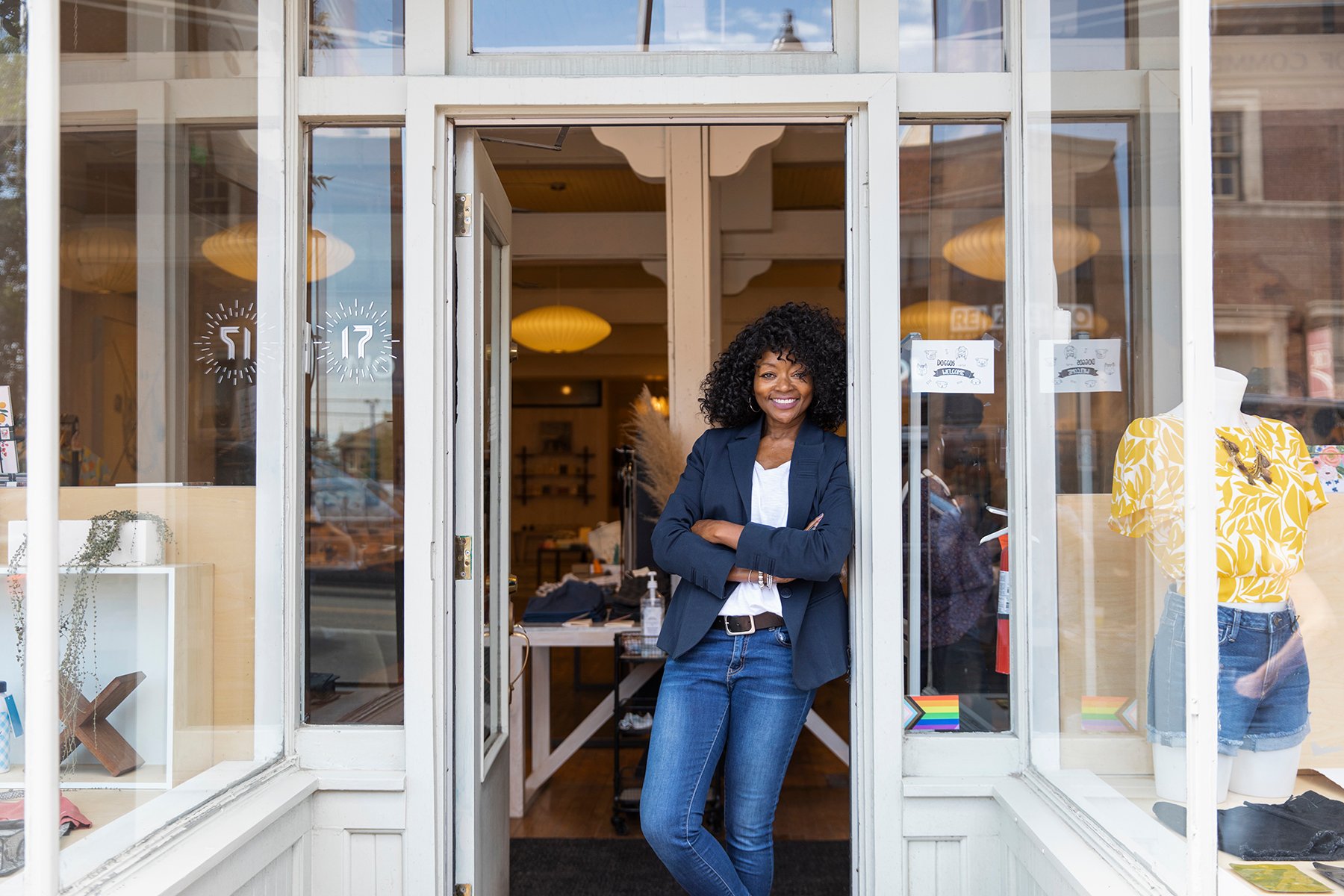 Stock photo of proud African American female store owner
